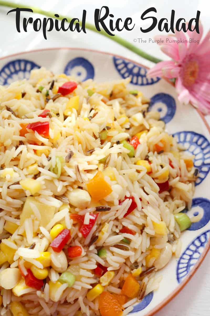 Tropical Rice Salad. This salad is a colourful mix of different flavours and textures, made with ingredients like wild rice, peppers, mangoes, and macadamia nuts. It is a tasty salad to eat on its own, or as a side to barbecued meat and fish. Also great to take to a potluck or on a summer picnic.