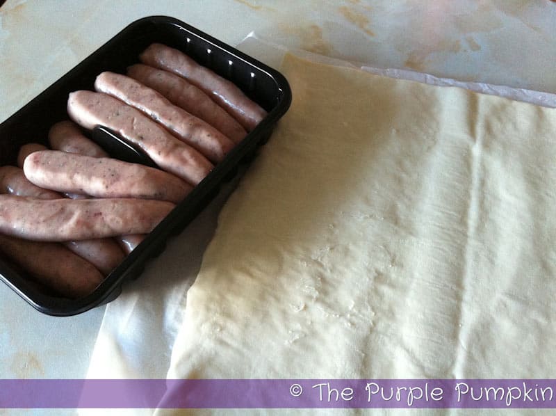 a pack of chipolata sausages and puff pastry on a kitchen counter top