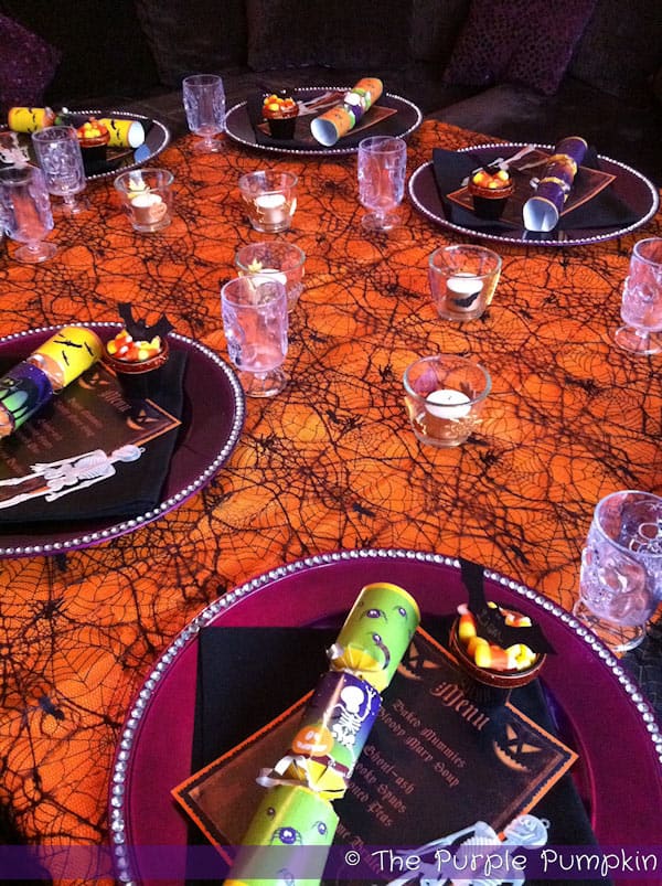 Halloween menus sitting on dinner plates