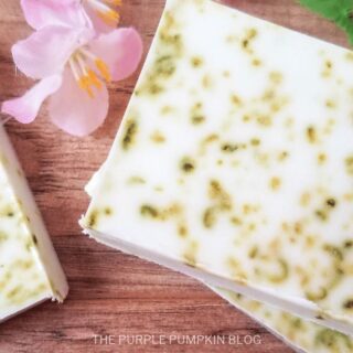 3 Bars of Homemade Coconut Lime Soap surrounded by pink flowers