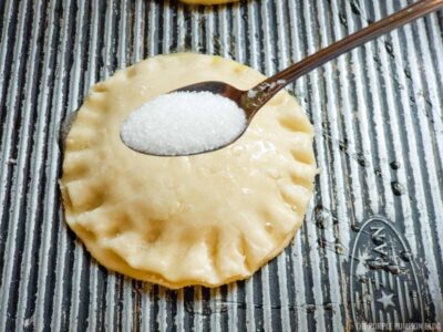 Sprinkling pies with sugar