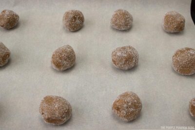 cookie balls on baking sheet