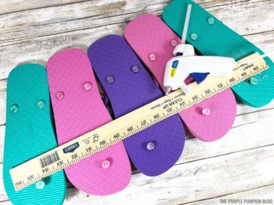 Attaching yard stick to back of flip flops