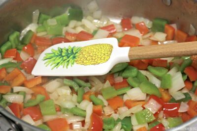Frying onions and bell peppers