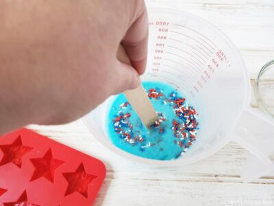 Stirring sprinkles into melted soap