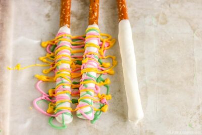 Tropical Pretzel Rods Process - drizzling candy melts
