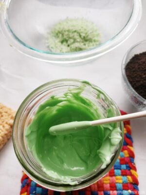 Dipping lolly stick into candy melts