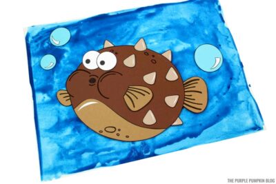 Pufferfish craft on blue painted background