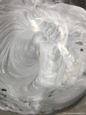 Adding cornstarch and cream of tartar to meringue mix