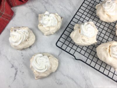 mini pavlovas topped with cream