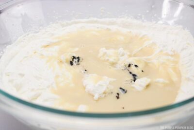 condensed milk and vanilla seeds added to the cream