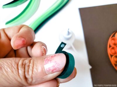 Adding glue to paper strip