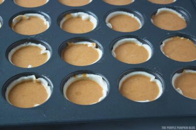 Pumpkin Pie Filling poured into pie cases
