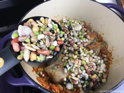 Adding beans to soup pot