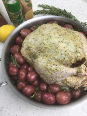 Chicken and potatoes ready for roasting