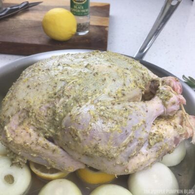 Flavored butter smeared on chicken