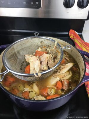 Straining off Chicken Meat & Vegetables