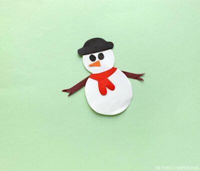 Attaching arms to snowman