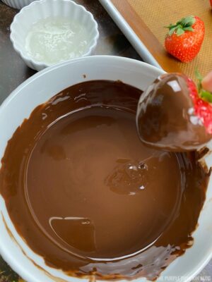 Dipping Strawberry into Melted Chocolate