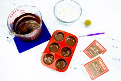 Adding Melted Chocolate to Molds