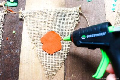 Gluing Gnome Pieces onto Burlap