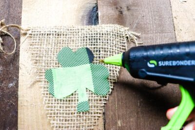 Gluing Shamrock Piece to Burlap