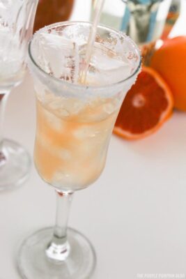 Pouring Grapefruit Juice into Glass