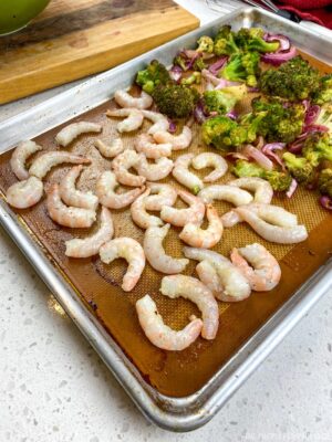 Adding Shrimp to Baking Sheet