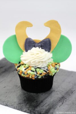 Placing the ears behind the horns and bow