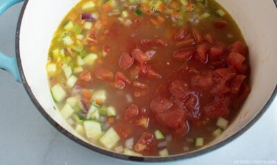 Adding Chopped Tomatoes to Pot
