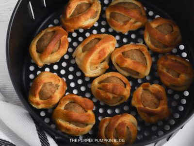 Cooked Mummy Meatballs in Air Fryer Basket