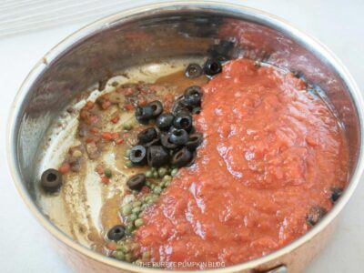 Adding Crushed Tomatoes to Pan
