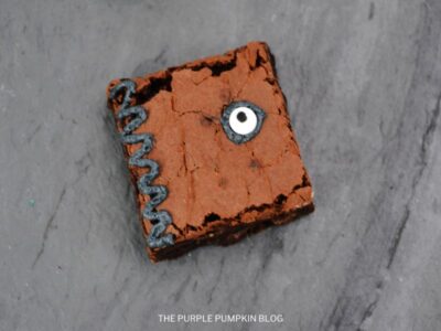 Brownie with Candy Eyeball and Piping along the edge