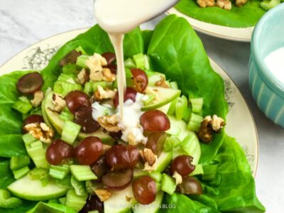 Drizzling Dressing over Waldorf Salad