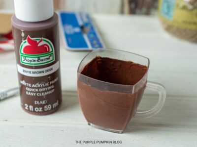Applying Brown Paint to Cup