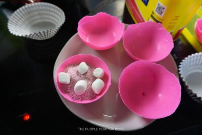 Adding Strawberry Powder and Mini Marshmallows to Bombs