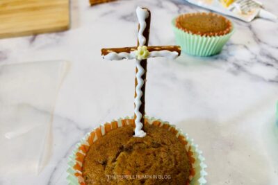 Inserting Cross into Cupcake