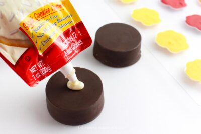 Attaching Candy Pawprints to Cookie