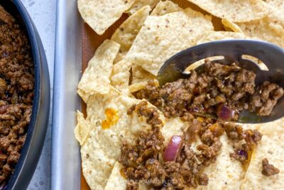 Adding Beef Mixture to Tortilla Chips