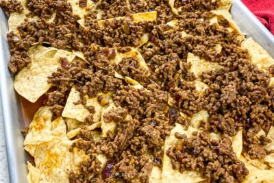 Adding Cooked Ground Beef to Tortilla Chips
