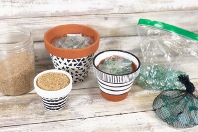 Filling Pots with Rocks & Sand