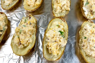 Filling the Baked Potatoes with Mixture