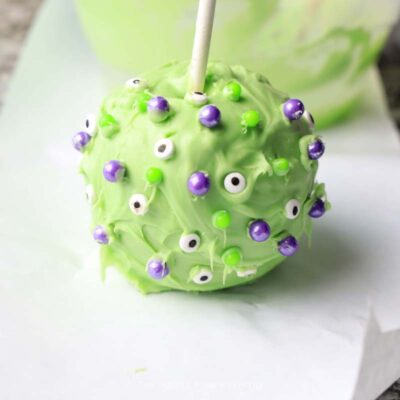 Adding Sprinkles to Candy Apples