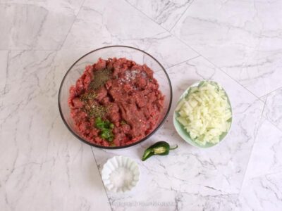 Bowl of Ground Beef with Spices & Onions on the Side