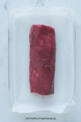 Raw Beef Tenderloin on Baking Sheet