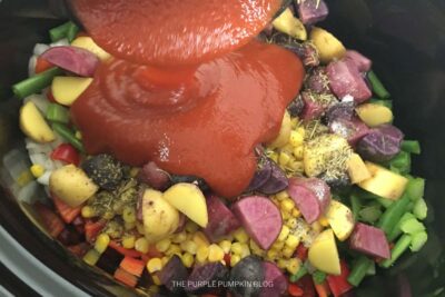 Adding Tomato Puree to Pot
