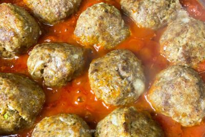 Meatballs Cooking in Tomato Sauce