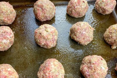 Prepared Meatballs on Baking Sheet