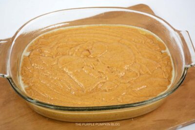 Pumpkin Earthquake Cake Batter in Baking Dish