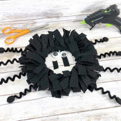 Attaching Eyes to Spider Wreath